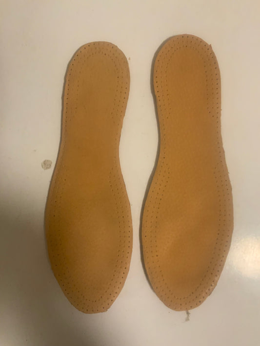 Double thick insoles in a track spike or a shoe with a plastic sole.